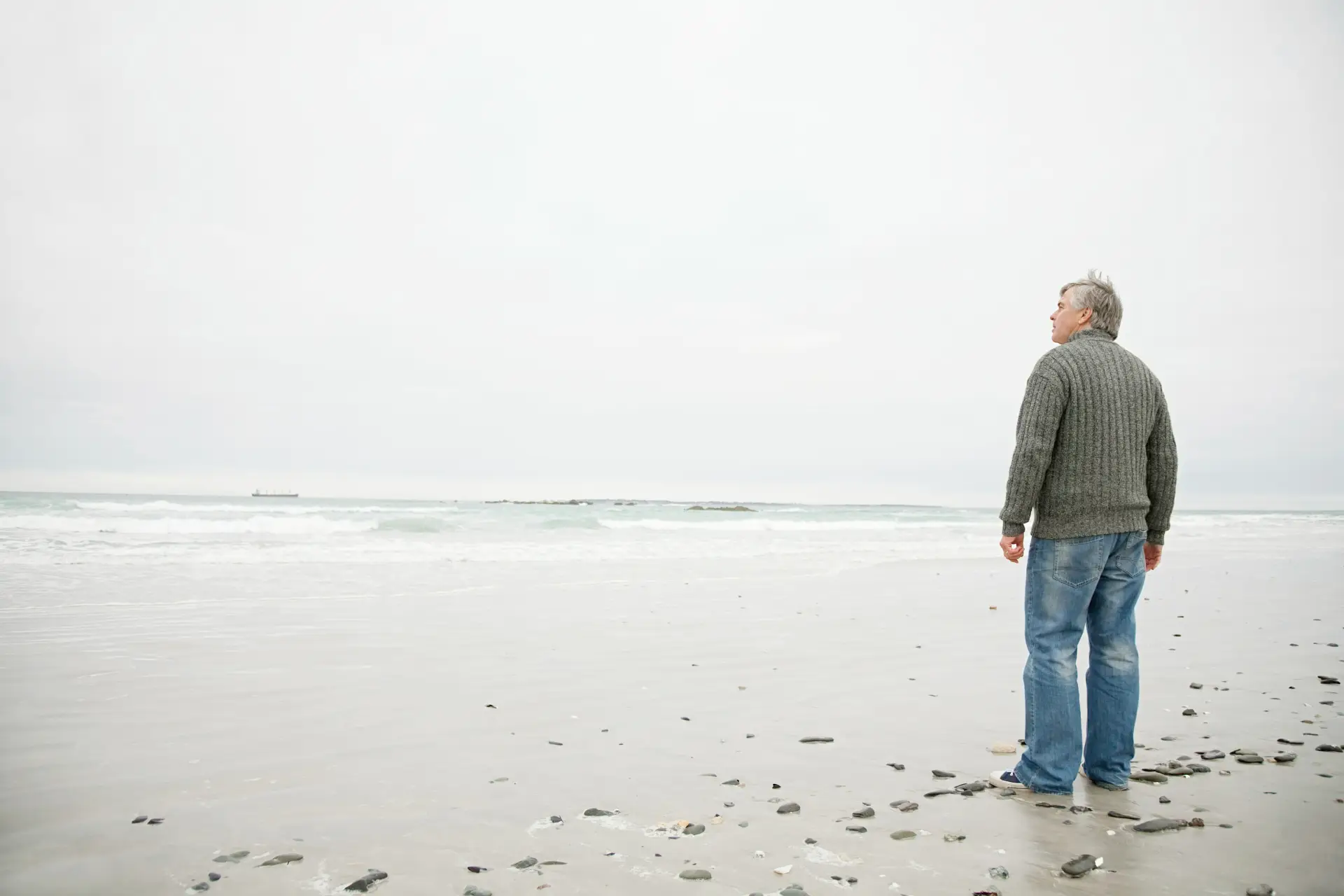 man contemplating the vast ocean man contemplating the vast ocean